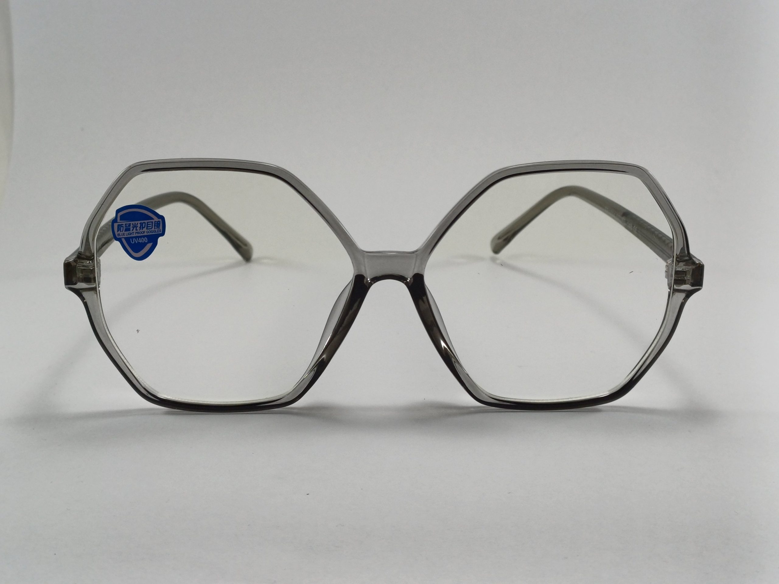 عینک بلوکات چند ضلعی مخصوص مطالعه و کامپیوتر رنگ دودی با جلد و دستمال عینک بلوکات چند ضلعی مخصوص مطالعه و کامپیوتر رنگ دودی با جلد و دستمال