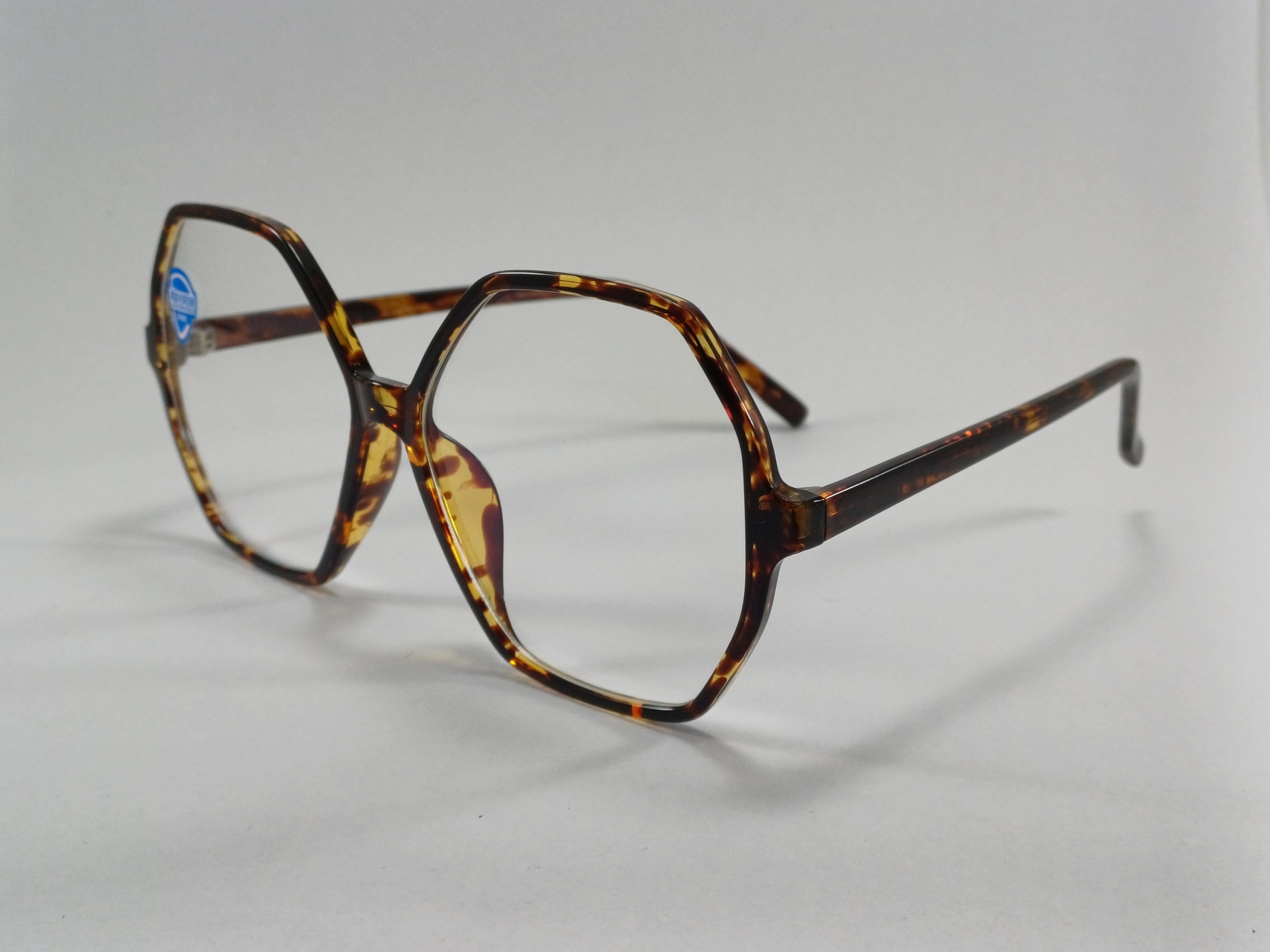 عینک بلوکات چند ضلعی مخصوص مطالعه و کامپیوتر رنگ تایگر قهوه ای با جلد و دستمال عینک بلوکات چند ضلعی مخصوص مطالعه و کامپیوتر رنگ تایگر قهوه ای با جلد و دستمال